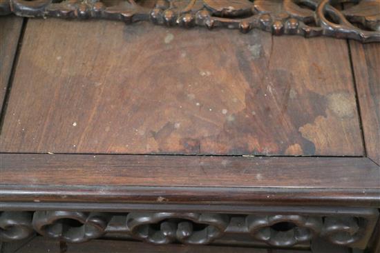 A Chinese nest of three carved hardwood tea tables, each with pierced frieze W.45cm approx.